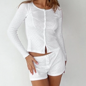 White pointelle knit two-piece pajama set with long sleeve button top and lace trim shorts