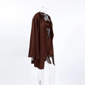 Detail of three-piece chocolate brown satin sleepwear set with robe, top and shorts