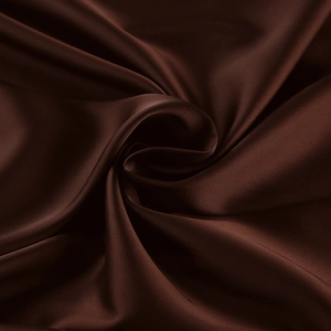 Macro detail of high-luster satin fabric with smooth silk texture and deep coffee color