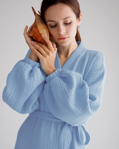 Detail of light blue double gauze cotton robe showing soft texture and bubble sleeve cuffs