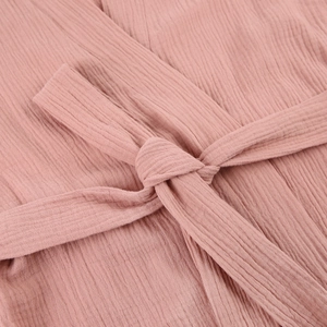 Detail of pink double-layer cotton gauze bathrobe featuring soft texture and waist tie