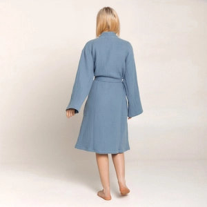 Detail view of grey blue cotton crepe bathrobe showing textured fabric and waist tie