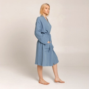 Detail view of dusty blue crepe cotton bathrobe with waist tie and large front pocket