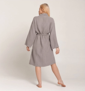 Back view of a dark grey waffle weave cotton bathrobe with tie belt for home wear