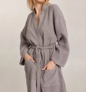Close-up of grey cotton crepe bathrobe showing waffle texture and waist tie detail