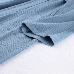 Detailed close-up of blue double gauze cotton robe featuring soft crinkled texture