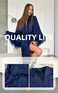 Deep blue satin lounge robe featuring elegant feather cuffs and a matching tie belt