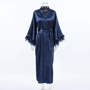 Detailed view of luxury blue satin robe featuring plush feather trim on sleeves and tie waist
