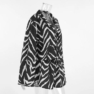 Detail of zebra print pajama set featuring a collared long sleeve top and drawstring shorts