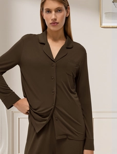 Detail of dark brown modal pajamas featuring classic notched lapels and button closure
