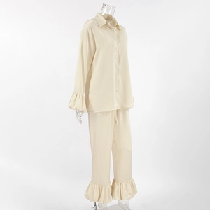 Detailed view of satin loungewear set with elegant ruffle sleeves and pants