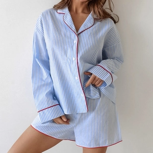 Blue and white striped cotton pajama set with red trim featuring long sleeves and shorts