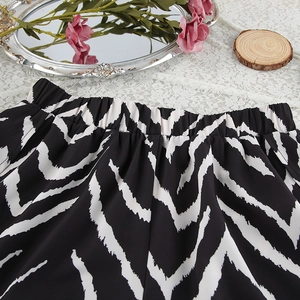 Detail of elastic waistband and zebra print pattern on lightweight pajama shorts