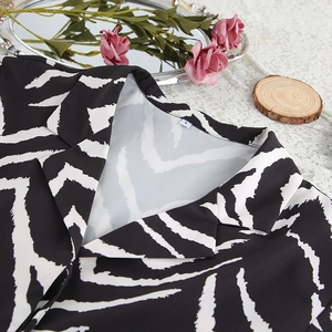Detail view of V-neck zebra print pajamas set featuring premium fabric and L size label