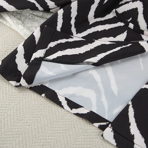 Detail of zebra print pajama hem with professional stitching and inner lining