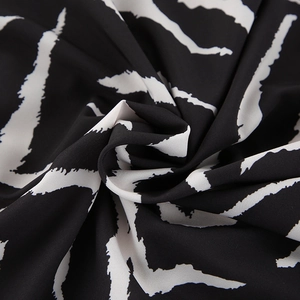 Macro shot of zebra print fabric showing soft texture and artistic drape on loungewear