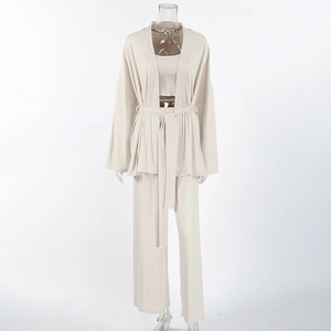 Three-piece apricot loungewear set with cardigan, camisole, and wide-leg pants