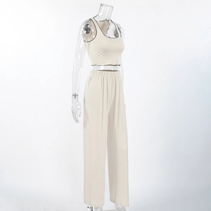Detail view of apricot loungewear set featuring contrast black trim on the cropped vest top