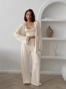 Detail view of cream white three-piece loungewear set with soft rib-knit cardigan and pants