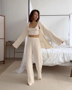 Detailed view of beige 3-piece loungewear set with ruffled camisole and tie-front cardigan