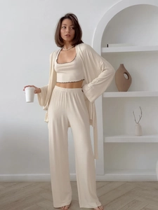 Detailed texture of milk silk pajama set with scalloped edges and premium knit fabric