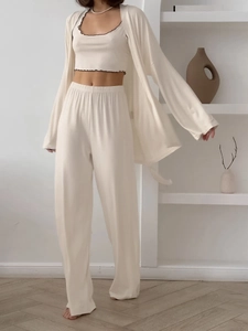 Detailed view of apricot milk silk three-piece lounge set with soft ruffled tank top