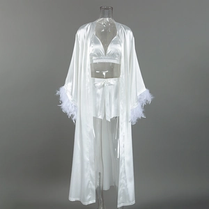 Three-piece white satin loungewear set with elegant feather-trimmed cuffs on long robe