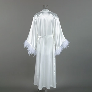 Detailed back view of white satin robe featuring luxurious feather trim on cuffs