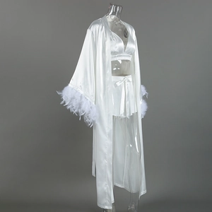 Detailed look at the luxurious satin robe sleeve featuring fluffy white feather trim accents