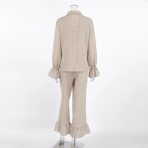Detail view of cotton plaid pajama set back featuring ruffle trim cuffs and hemlines