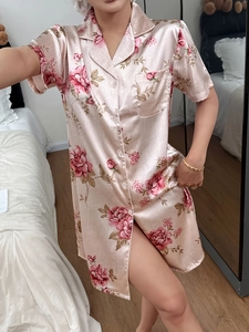 Detail of short sleeve pink floral satin nightshirt with notch collar and button down design