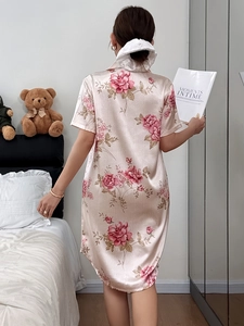 Back view of pink floral satin nightshirt showing the smooth texture and relaxed fit