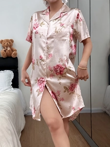 Detail of floral satin sleepshirt with notch lapel, chest pocket, and white buttons