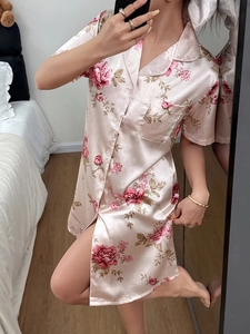 Detail of floral print short sleeve nightgown with satin texture and rose pattern