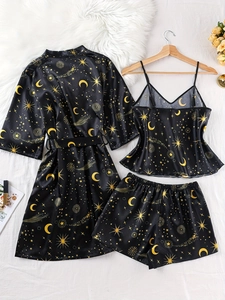 Detailed view of women's 3-piece satin pajama set with gold star and moon celestial prints