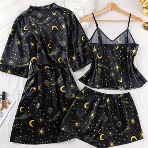 Women's 3-piece satin pajama set with golden moon and star print on black silk-like fabric
