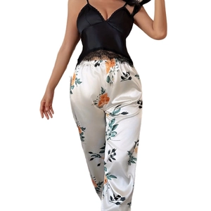 Women's two-piece silk pajamas set with lace camisole and floral print trousers