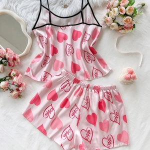 Pink satin two-piece pajama set with heart and Love print for women featuring camisole and shorts