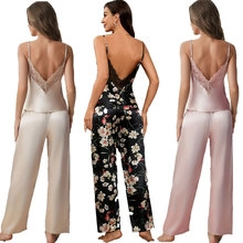 Deep V-back lace trim details on women's satin camisole and pants pajamas set