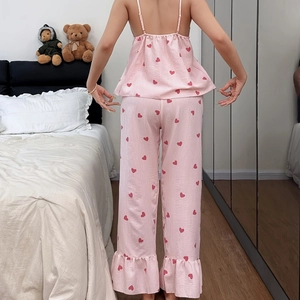 Women's pink striped pajama set with red hearts and ruffle hem, back view of camisole and pants