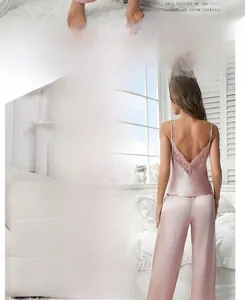 Detail of elegant lace trim and deep V-back on pink satin camisole pajama set