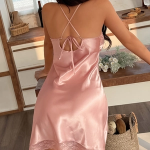 Pink satin nightgown for women with elegant lace trim and criss-cross back straps