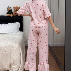 Pink striped cotton pajama set with red heart prints and ruffle hems for women