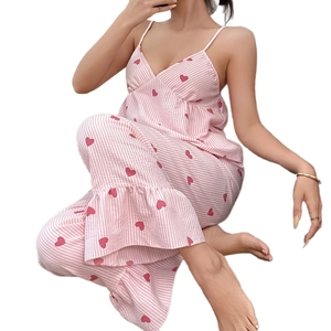 Women's pajama set featuring pink heart striped camisole and long pants loungewear