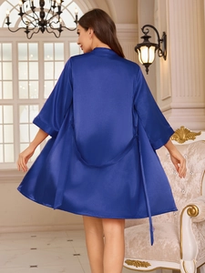 Back view of royal blue satin bathrobe showing smooth texture and elegant drape