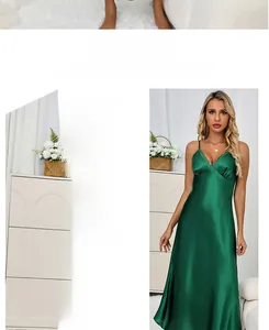 Detail view of dark green silk slip dress featuring V-neckline and delicate lace trim