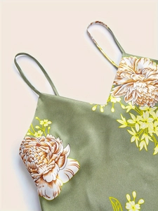 Detail of green floral satin camisole with adjustable straps and silk texture