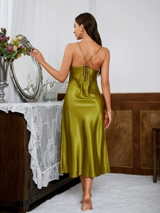 Detailed back view of an olive green satin sleepwear dress with cross thin straps