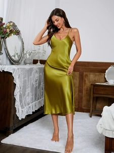 Close-up of olive green silk satin nightgown with deep V-neck and thin straps detail