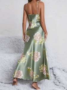 Detailed back view of a satin floral long dress with slim straps and open back